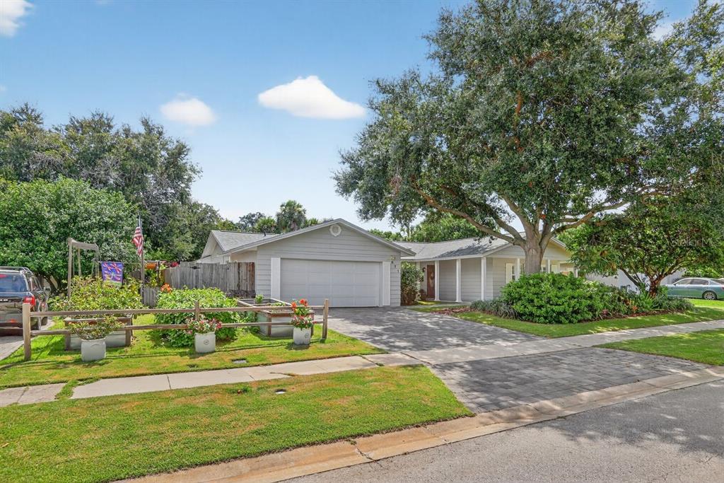 671 Brookside Road Maitland, FL 32751 - Photo 1 of 1 a front view of a house with a yard and potted plants