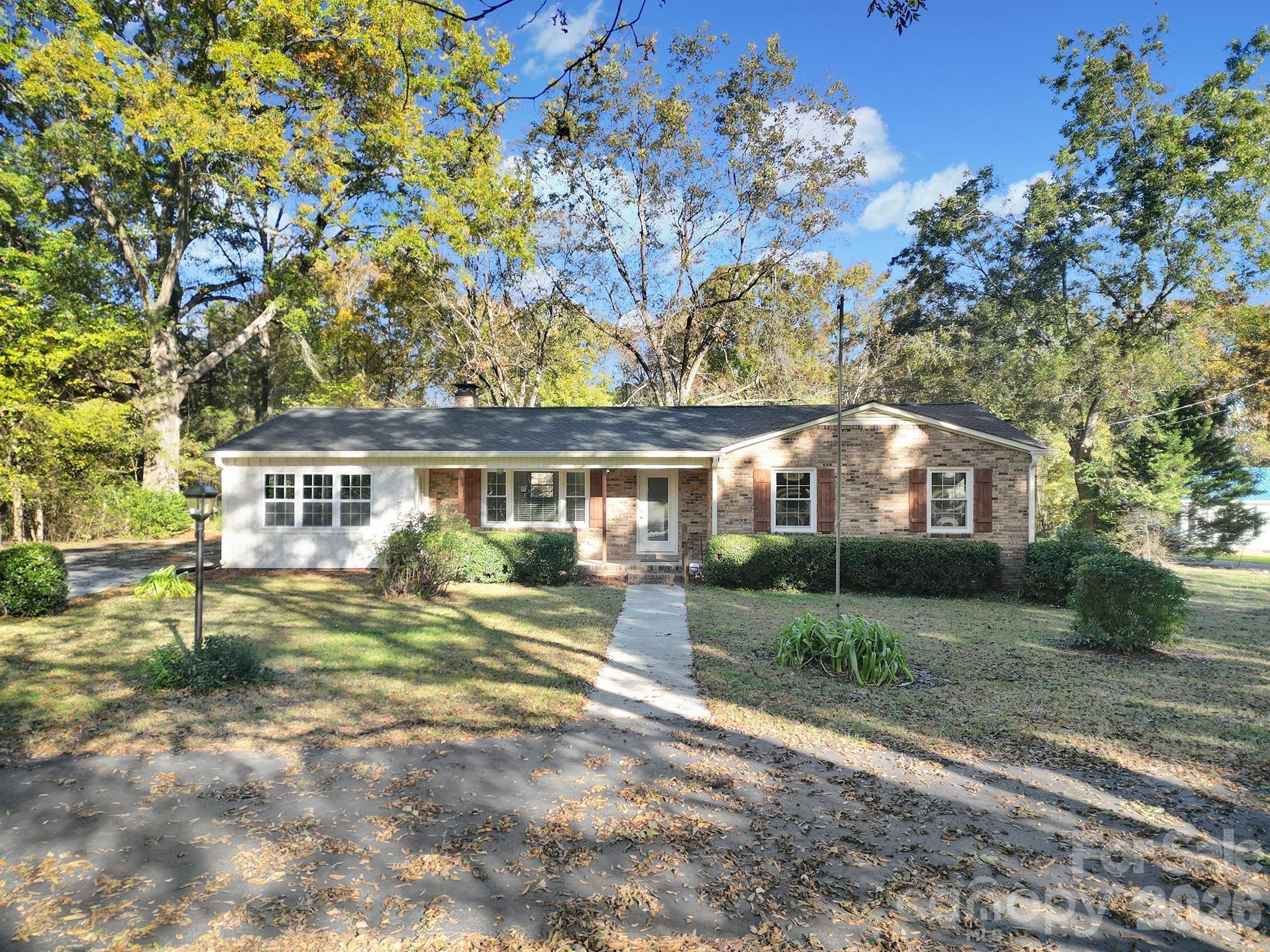 3987 Taxahaw Road Lancaster, SC 29720 - Photo 1 of 28 a front view of a house with a garden