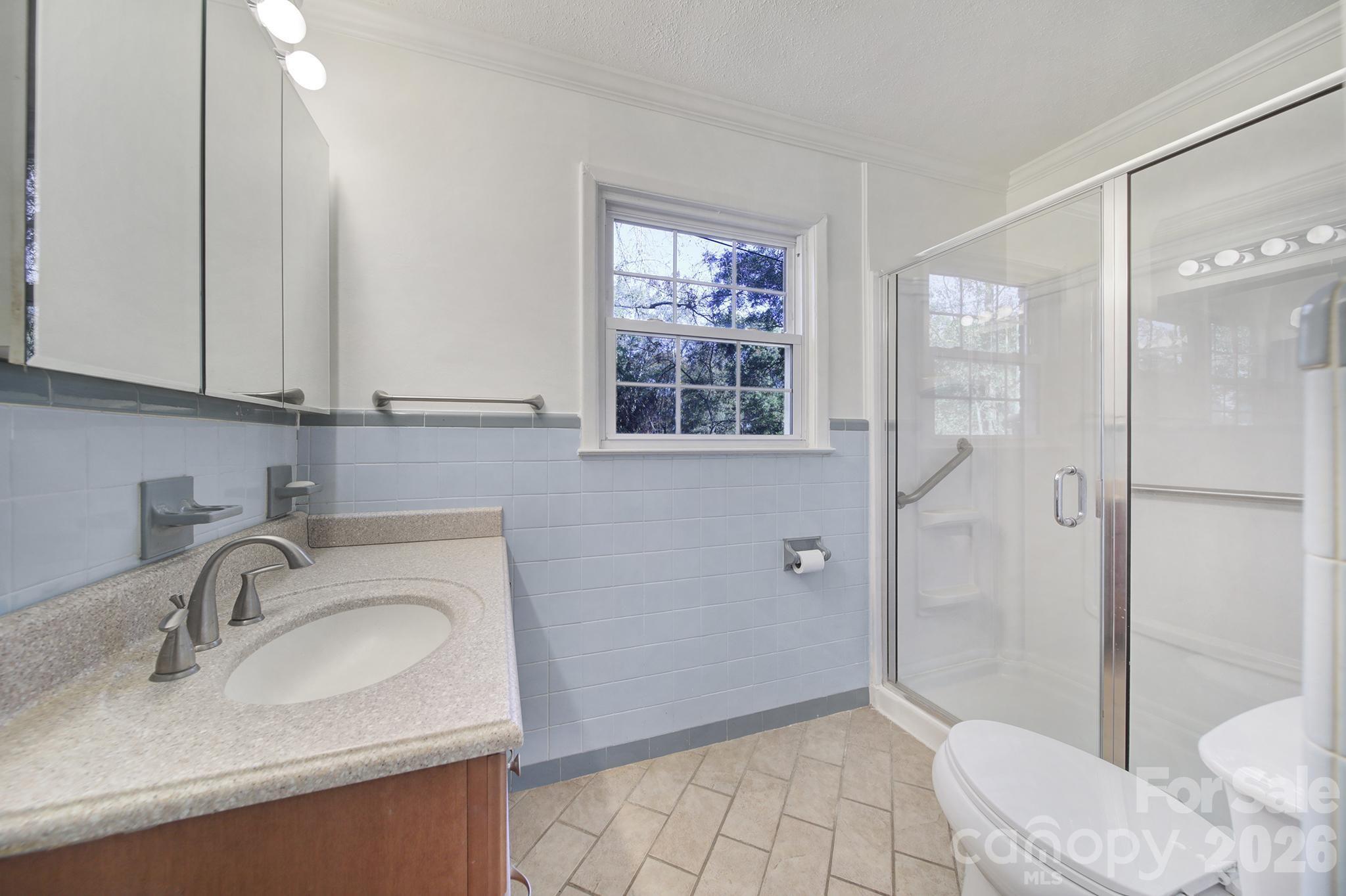3987 Taxahaw Road Lancaster, SC 29720 - Photo 12 of 28 a bathroom with a sink a toilet and shower