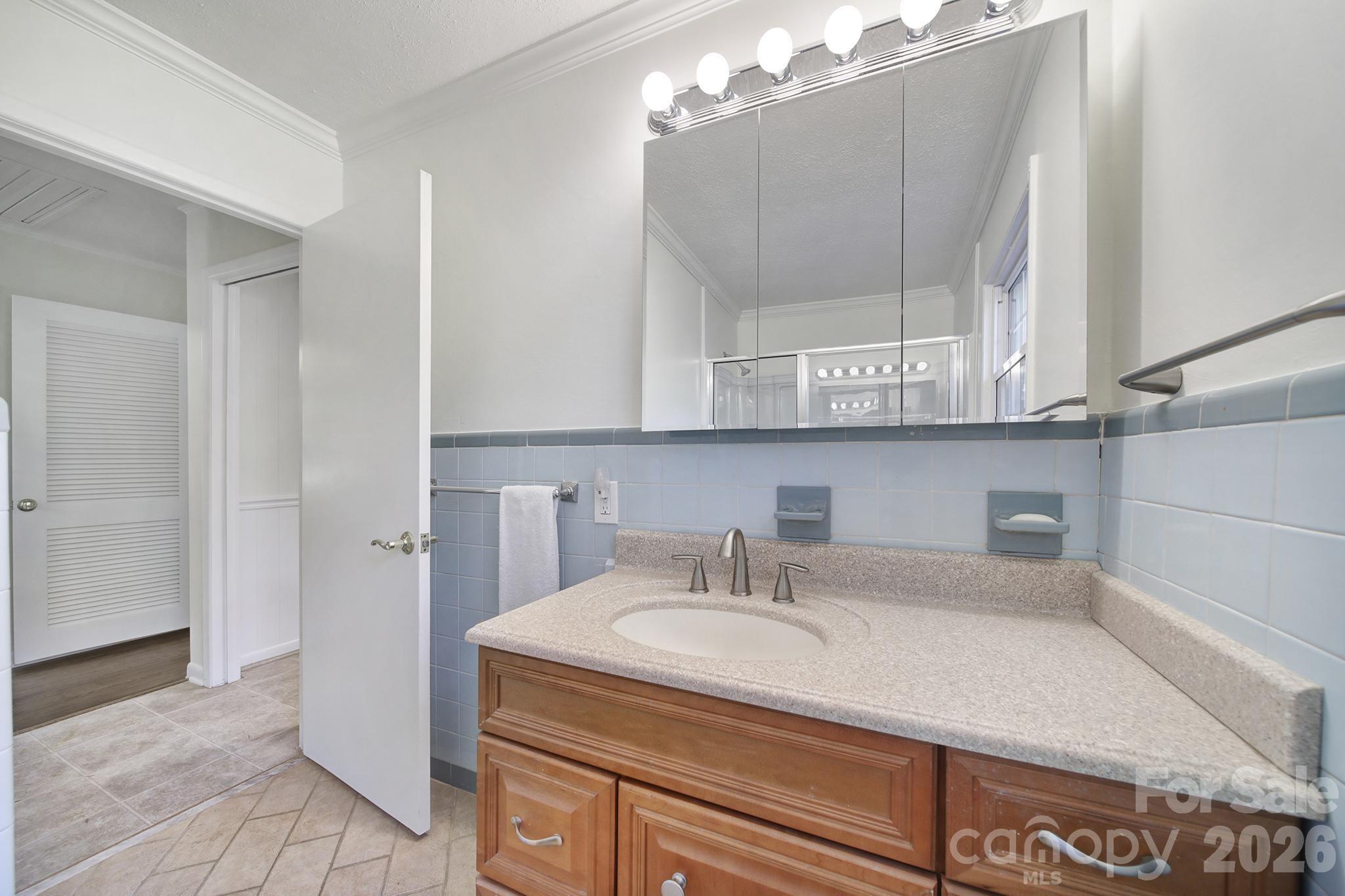 3987 Taxahaw Road Lancaster, SC 29720 - Photo 13 of 28 a bathroom with a sink and a mirror