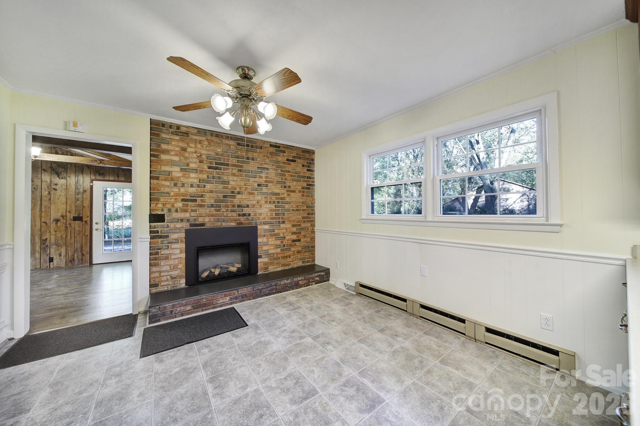 3987 Taxahaw Road Lancaster, SC 29720 - Photo 18 of 28 a living room with furniture and a fireplace
