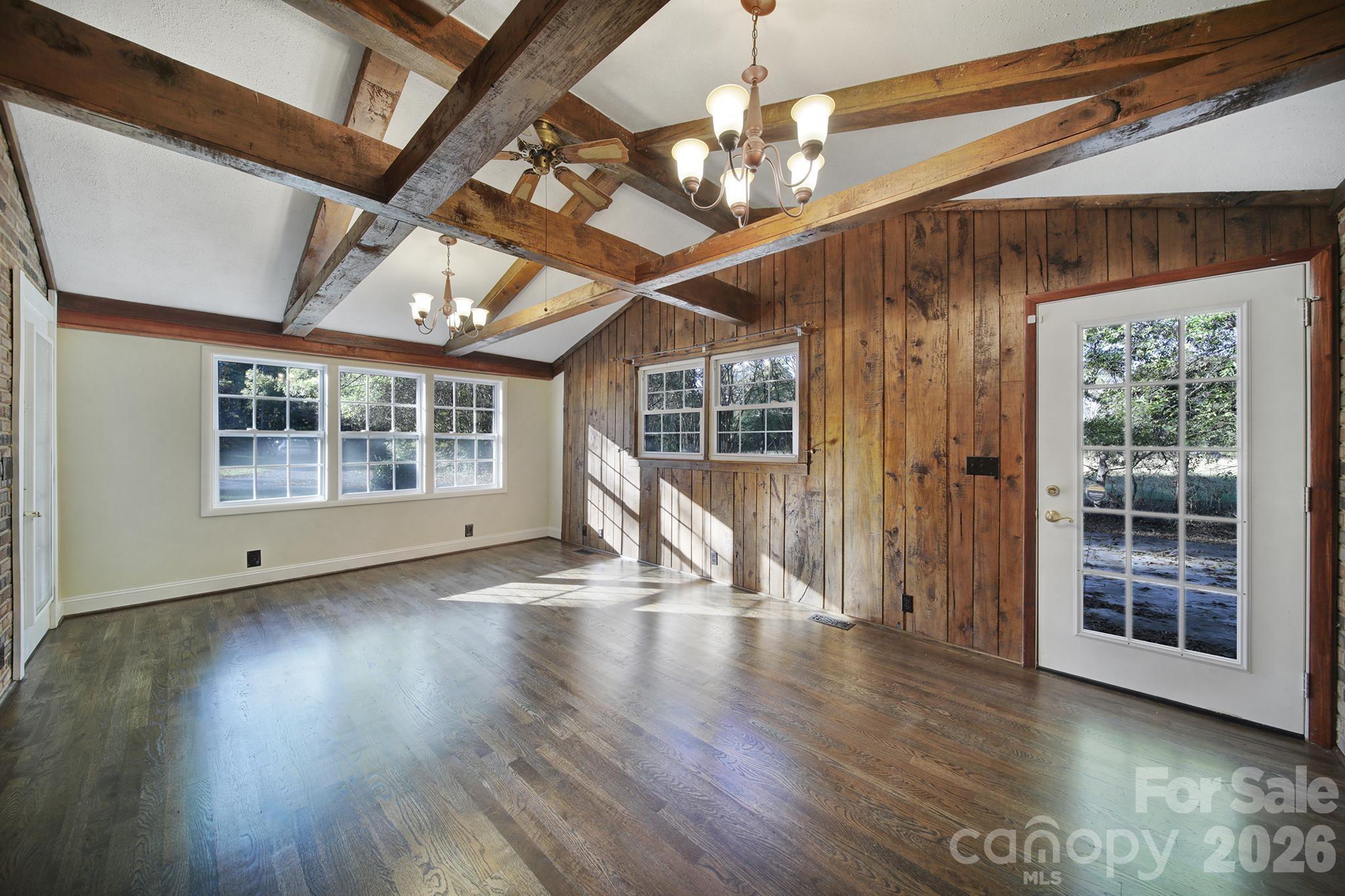 3987 Taxahaw Road Lancaster, SC 29720 - Photo 20 of 28 a view of an empty room with wooden floor and a window