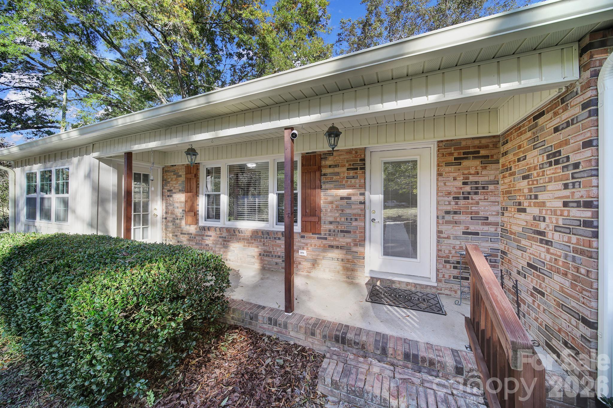 3987 Taxahaw Road Lancaster, SC 29720 - Photo 2 of 28 a view of a patio with table and chairs and potted plants