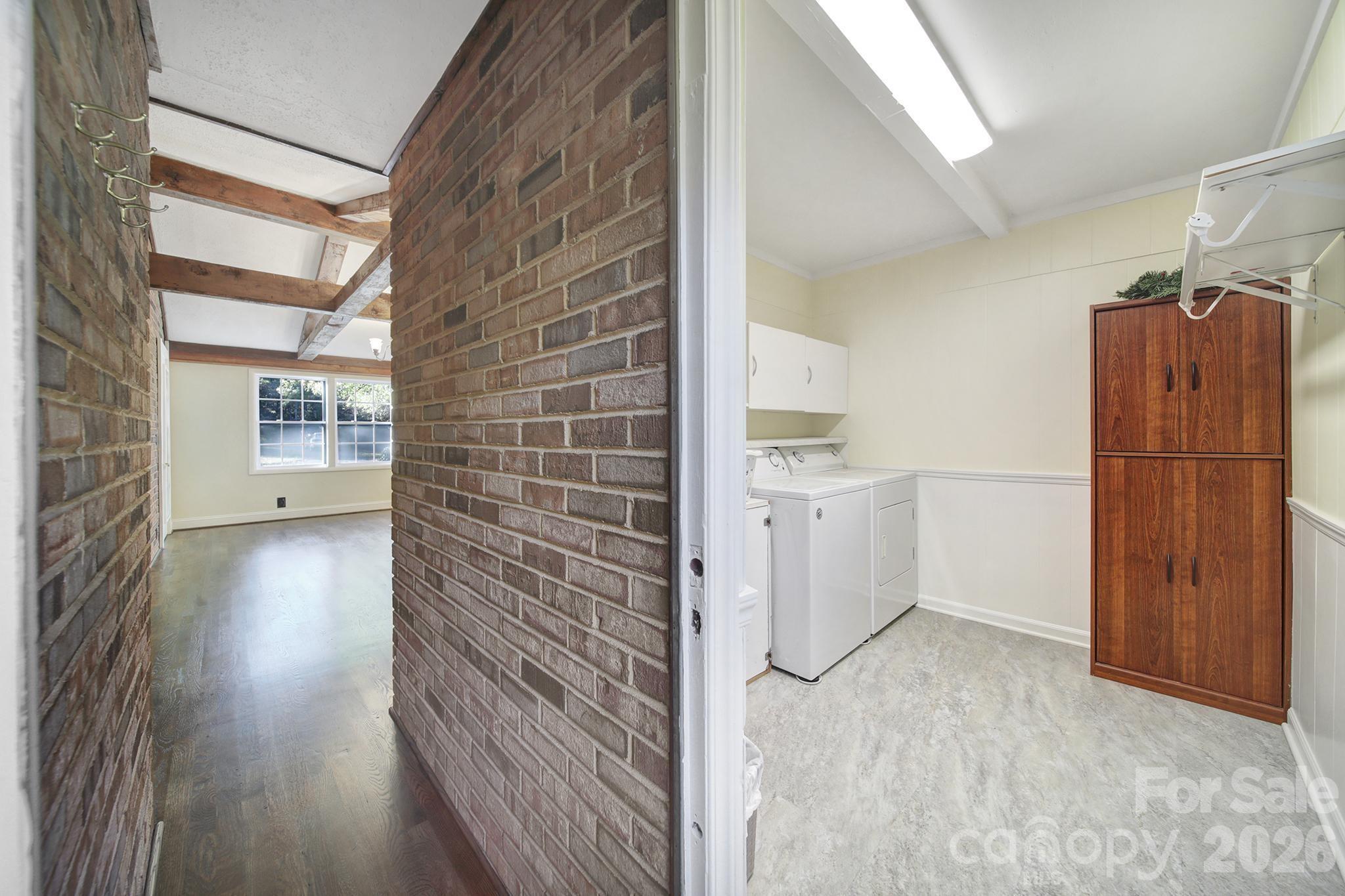 3987 Taxahaw Road Lancaster, SC 29720 - Photo 22 of 28 a view of a hallway with wooden floor and cabinets