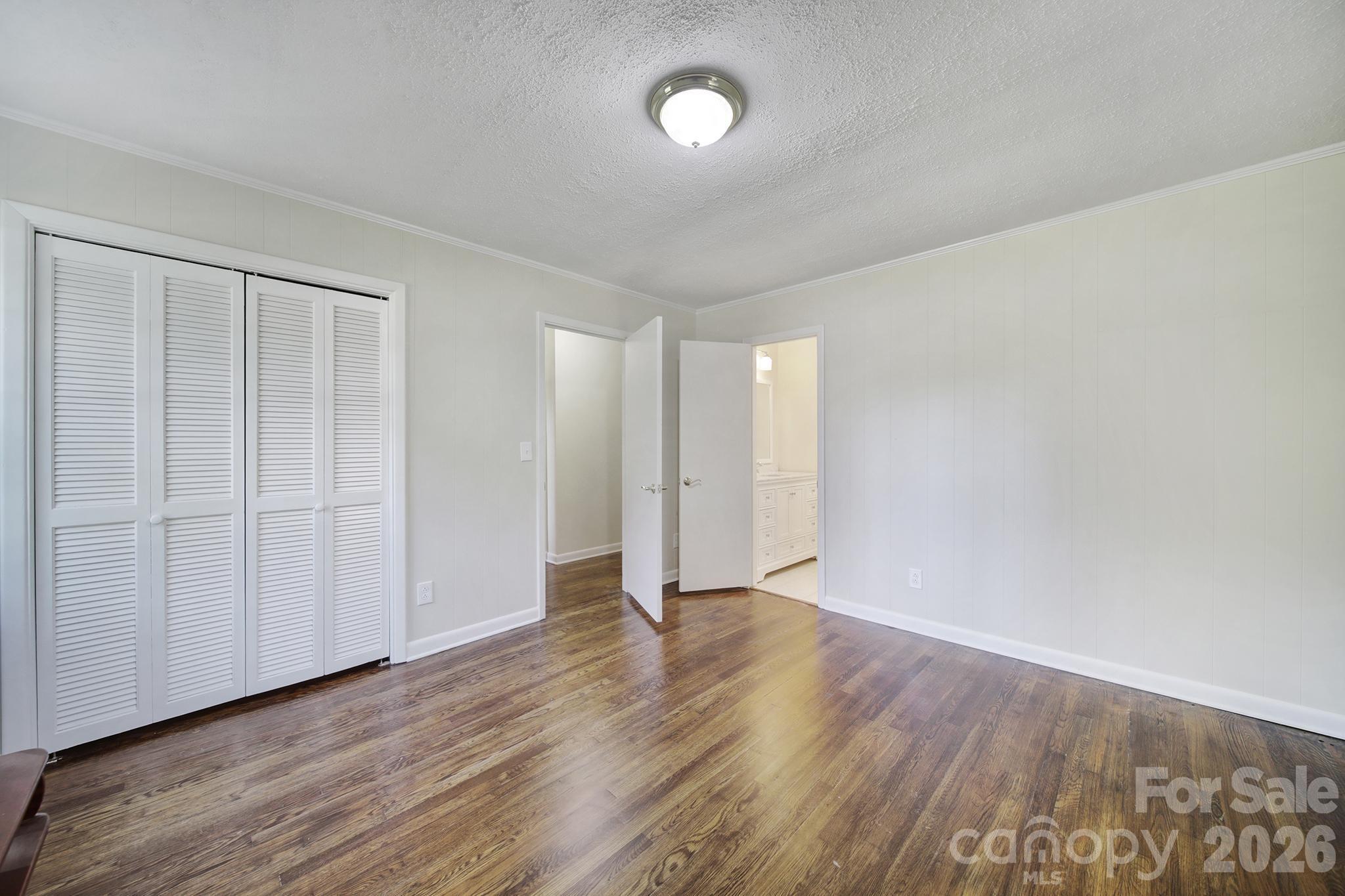3987 Taxahaw Road Lancaster, SC 29720 - Photo 7 of 28 a view of an empty room with wooden floor