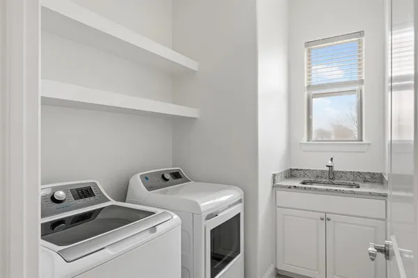 a utility room with dryer and washer