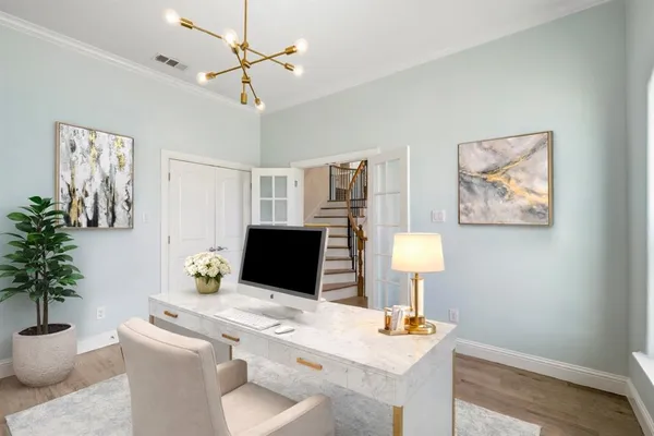 a workspace with furniture and a lamp