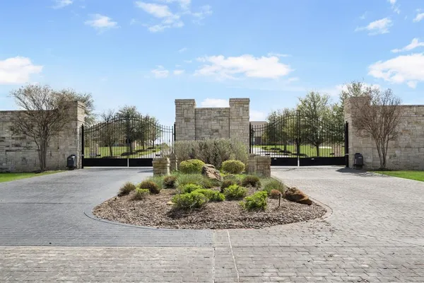 a view of a garden with a building in the background