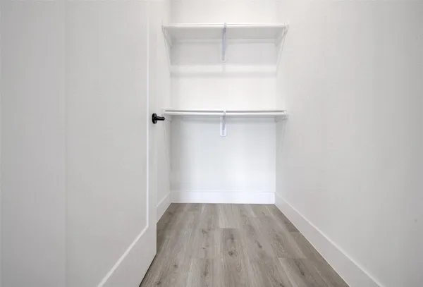 a view of a small space with wooden floor