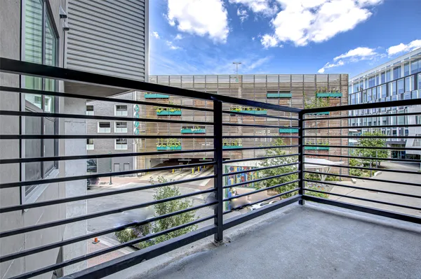 a view of a balcony with a bench