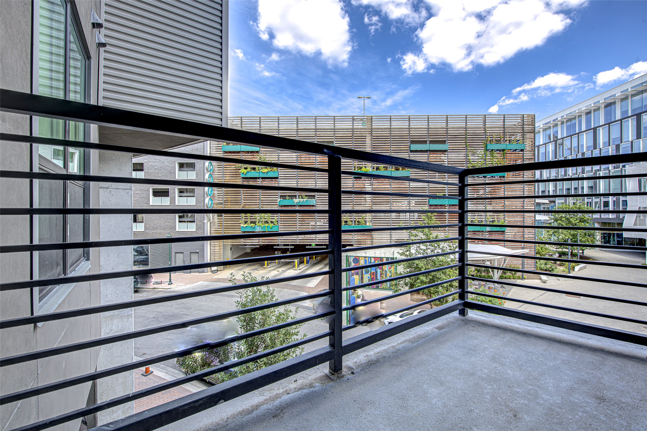 1701 Simond Avenue, Unit 229 Austin, TX 78723 - Photo 18 of 20 a view of a balcony with a bench