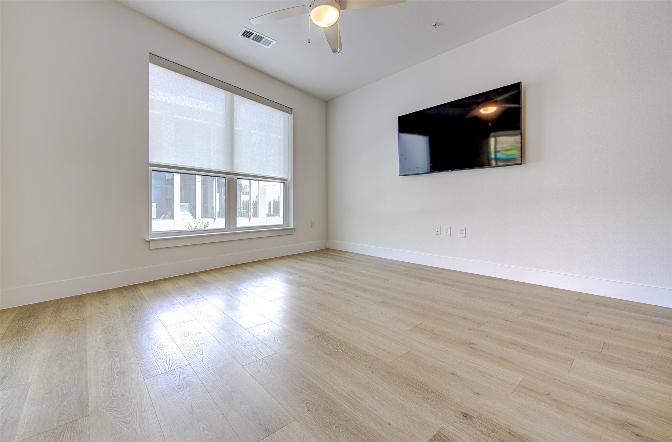 1701 Simond Avenue, Unit 229 Austin, TX 78723 - Photo 3 of 20 a view of a livingroom with wooden floor fireplace and a window