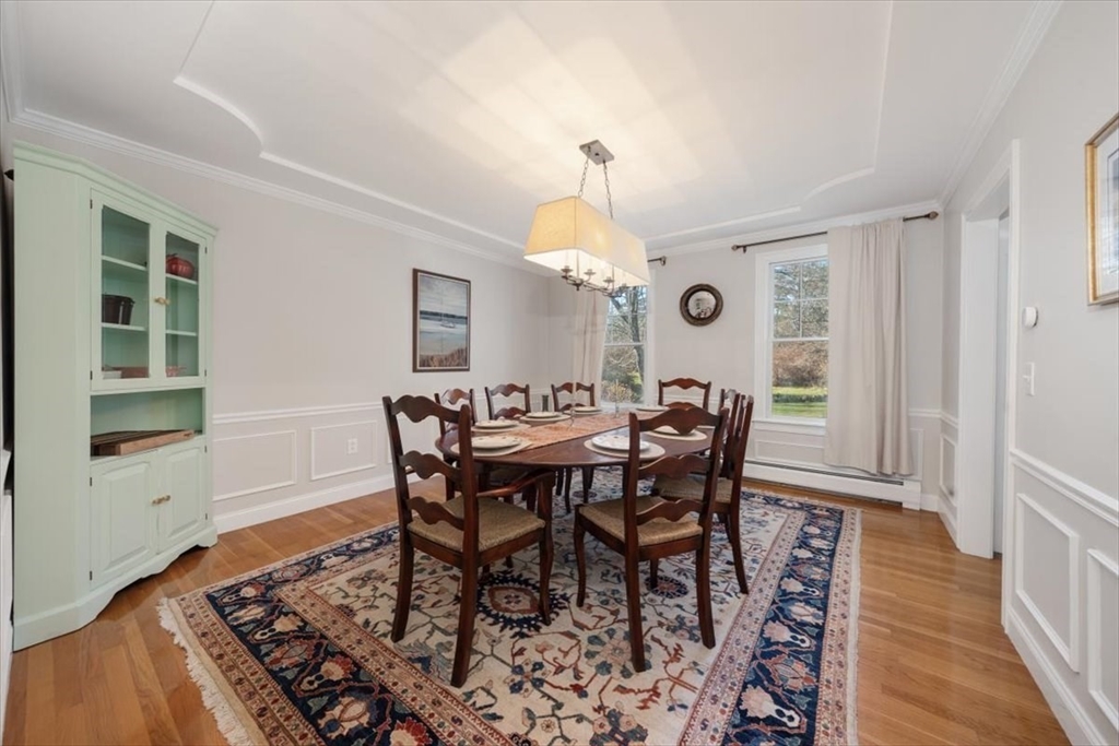 125 Maple Street Scituate, MA 02066 - Photo 14 of 42 a view of a dining room with furniture and wooden floor