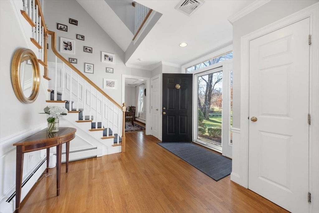 125 Maple Street Scituate, MA 02066 - Photo 2 of 42 a view of an entryway with wooden floor windows and a livingroom