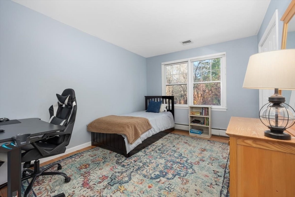 125 Maple Street Scituate, MA 02066 - Photo 26 of 42 a bedroom with a bed and a window