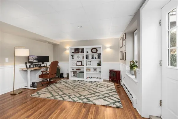 a view of a workspace with furniture and a bedroom