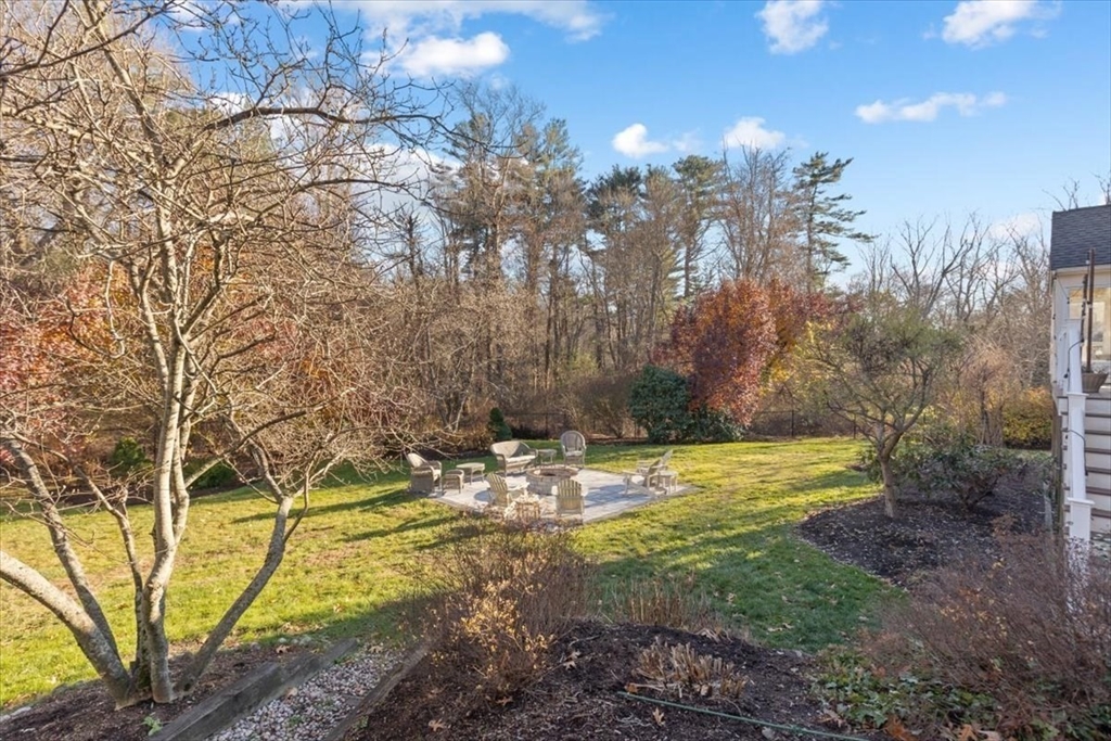 125 Maple Street Scituate, MA 02066 - Photo 34 of 42 a view of swimming pool and trees in the background
