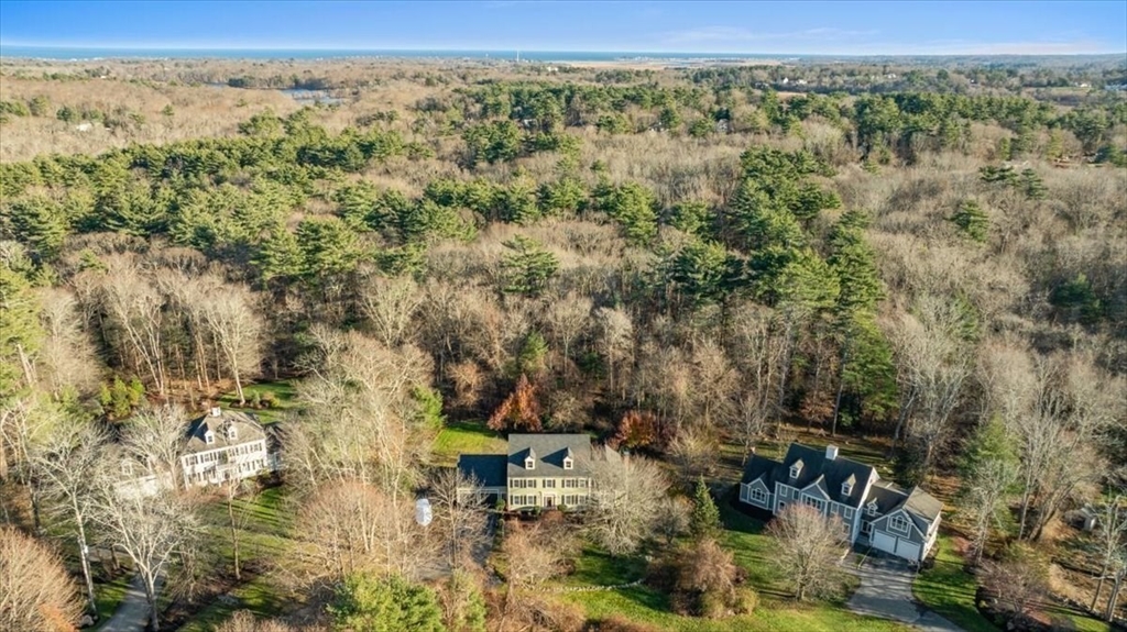 125 Maple Street Scituate, MA 02066 - Photo 36 of 42 a view of a city with lush green forest