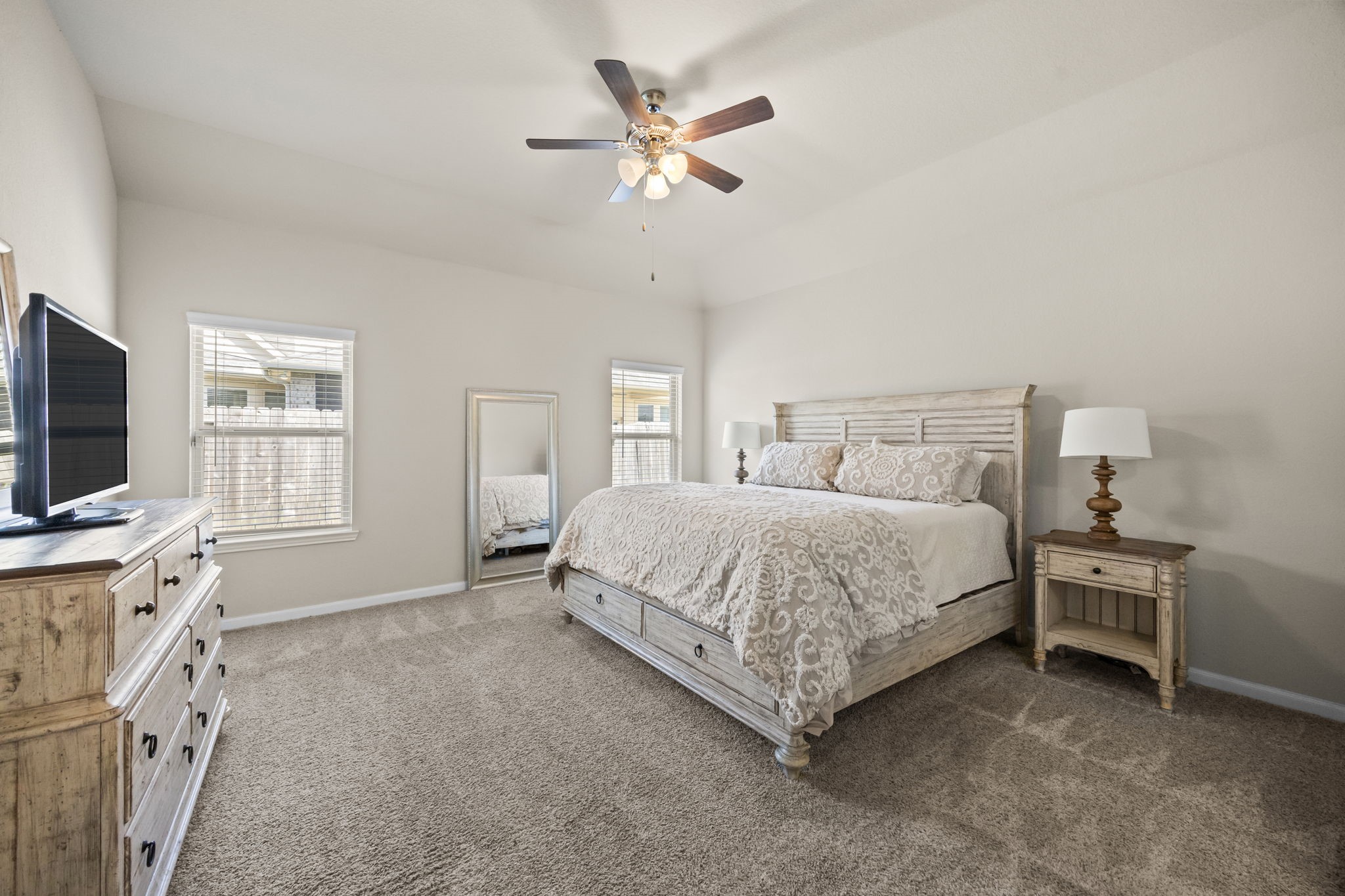 519 Yellow Bullhead Court Rosenberg, TX 77469 - Photo 10 of 24 The tranquil primary suite featuring high ceilings and plush carpet will be your escape at the end of a busy day. Ample room for large scale furniture and a sitting area.