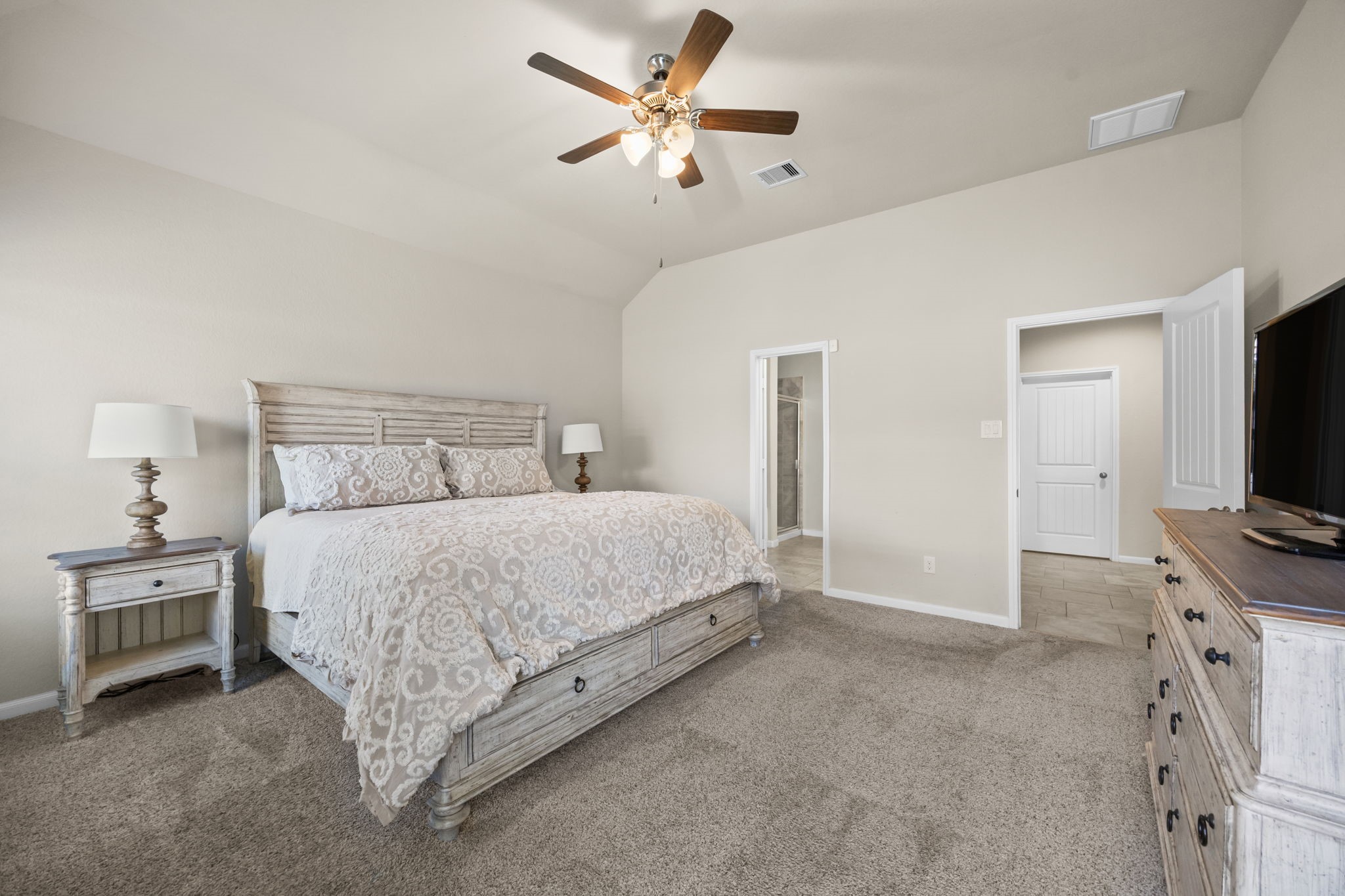 519 Yellow Bullhead Court Rosenberg, TX 77469 - Photo 24 of 24 Another view of the primary retreat. Split floor plan provides privacy. A glimpse of the exquisite spa like en suite bath.