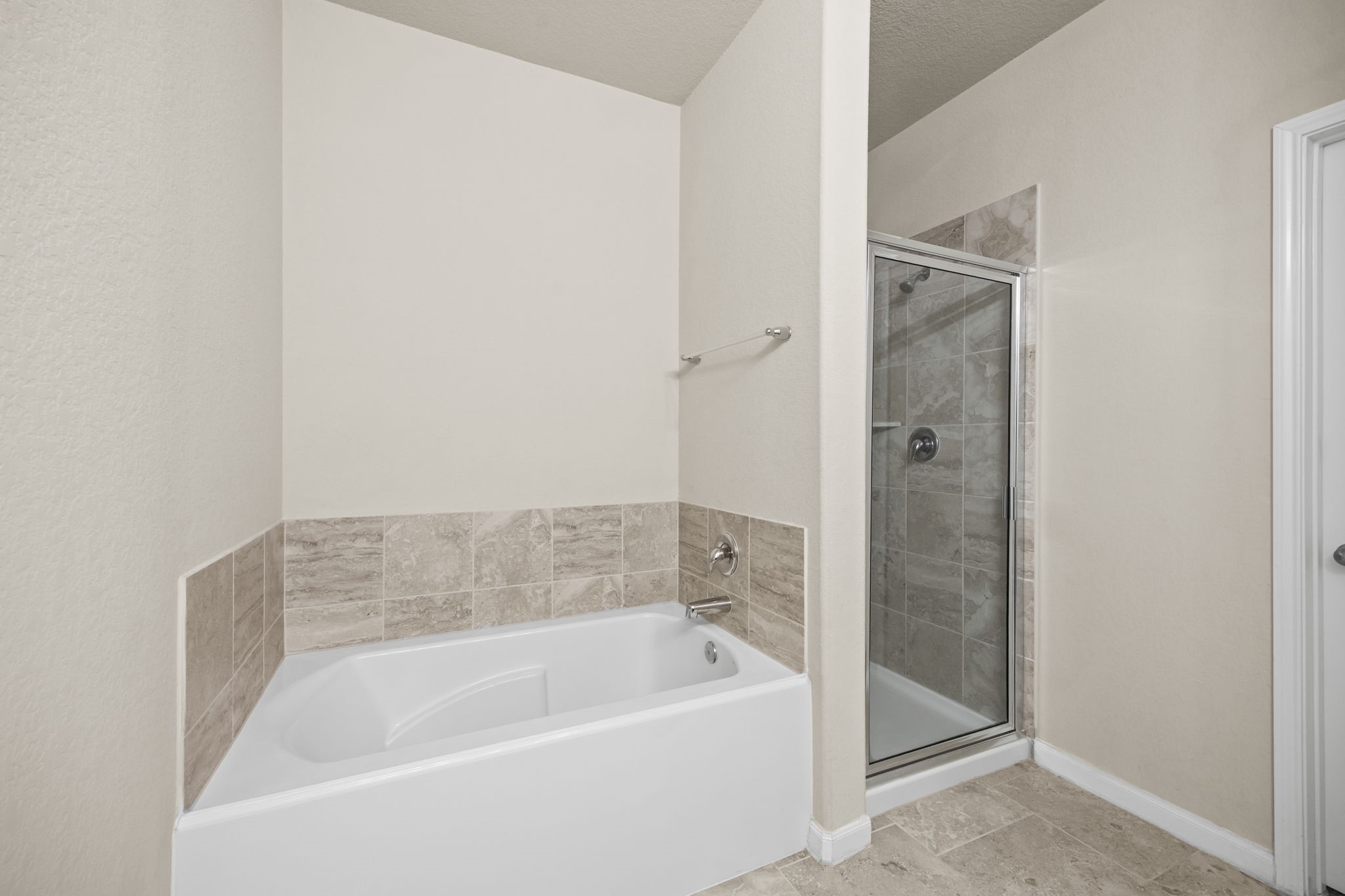 519 Yellow Bullhead Court Rosenberg, TX 77469 - Photo 12 of 24 Soak your cares away at the end of a busy day in the oversized soaking tub. The large walk in shower features a beautiful tile surround