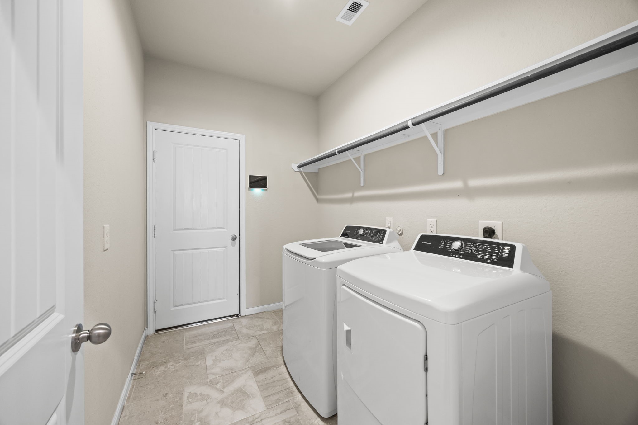 519 Yellow Bullhead Court Rosenberg, TX 77469 - Photo 17 of 24 Large laundry/mud room with built in shelving.