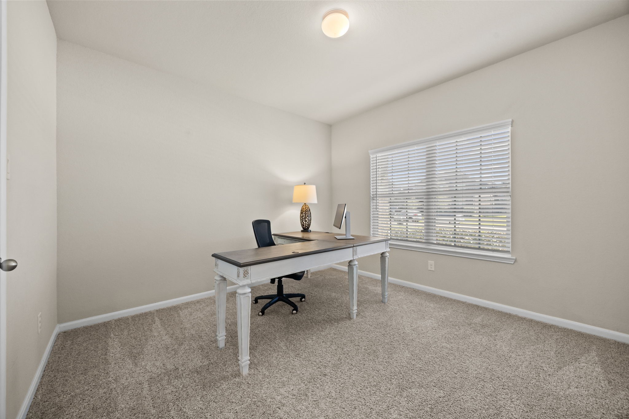 519 Yellow Bullhead Court Rosenberg, TX 77469 - Photo 5 of 24 The fourth bedroom located at the front of the home was used as a study. Perfect for those who work from home. Note plush carpet in the bedroom only, beautiful tile floors in all other areas of this home.
