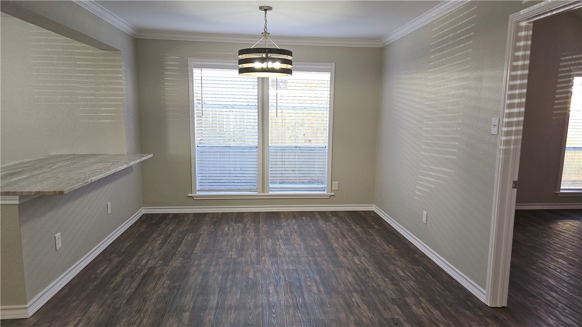 2438 Scotch Moss Drive Corpus Christi, TX 78414 - Photo 11 of 34 a view of an empty room with wooden floor and a window