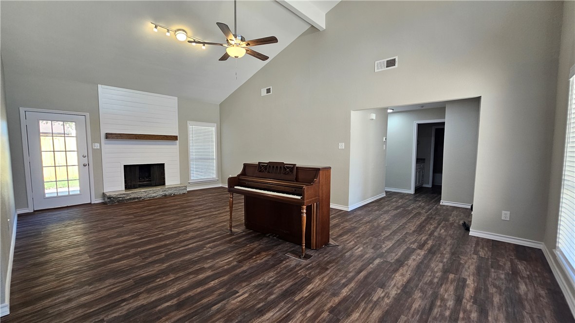2438 Scotch Moss Drive Corpus Christi, TX 78414 - Photo 13 of 34 an empty room with wooden floor fireplace and windows