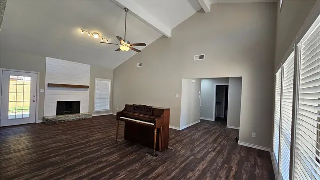 a view of livingroom with hardwood floor and a ceiling fan