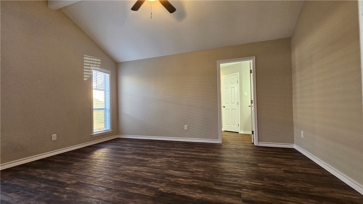 2438 Scotch Moss Drive Corpus Christi, TX 78414 - Photo 16 of 34 an empty room with wooden floor and windows