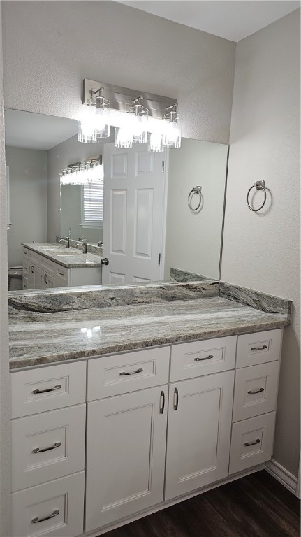 2438 Scotch Moss Drive Corpus Christi, TX 78414 - Photo 20 of 34 a bathroom with a granite countertop sink mirror and cabinets