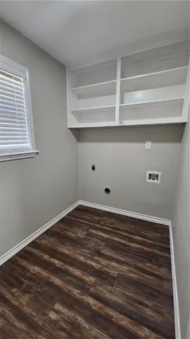 a view of a room with rack and wooden floor