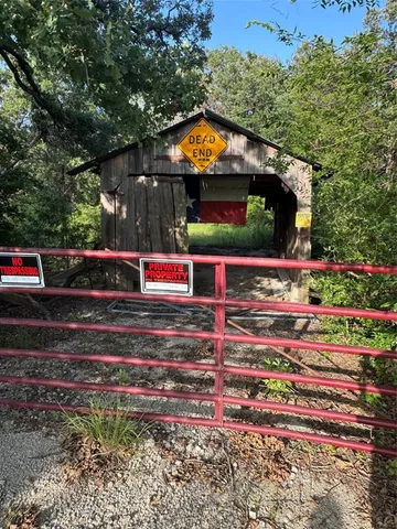 a view of a lake with a yard