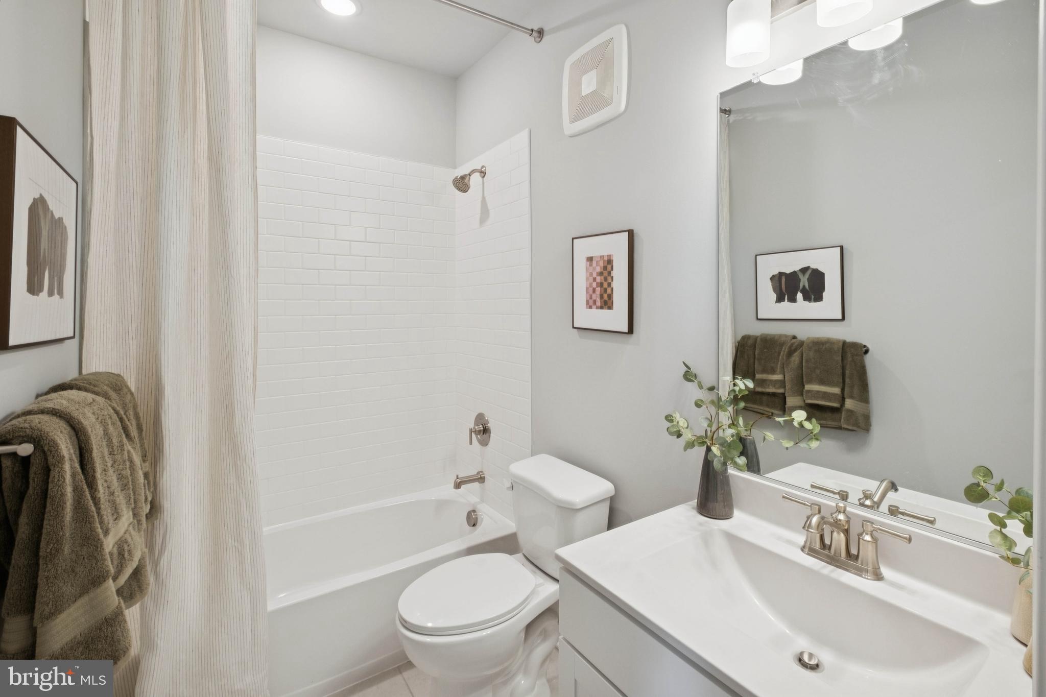 14962 Deco Circle Chantilly, VA 20151 - Photo 19 of 53 a bathroom with a sink toilet and shower