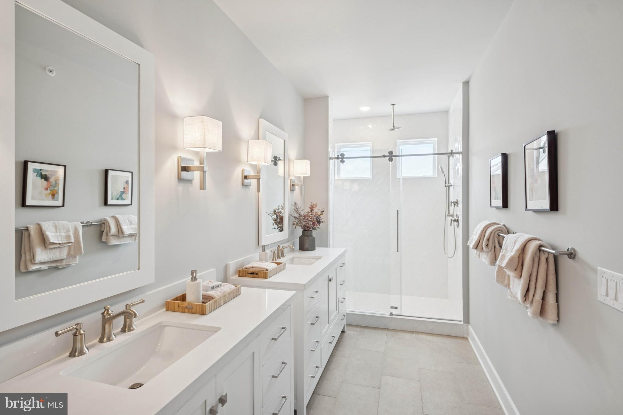 14962 Deco Circle Chantilly, VA 20151 - Photo 29 of 53 a bathroom with a double vanity sink mirror and shower