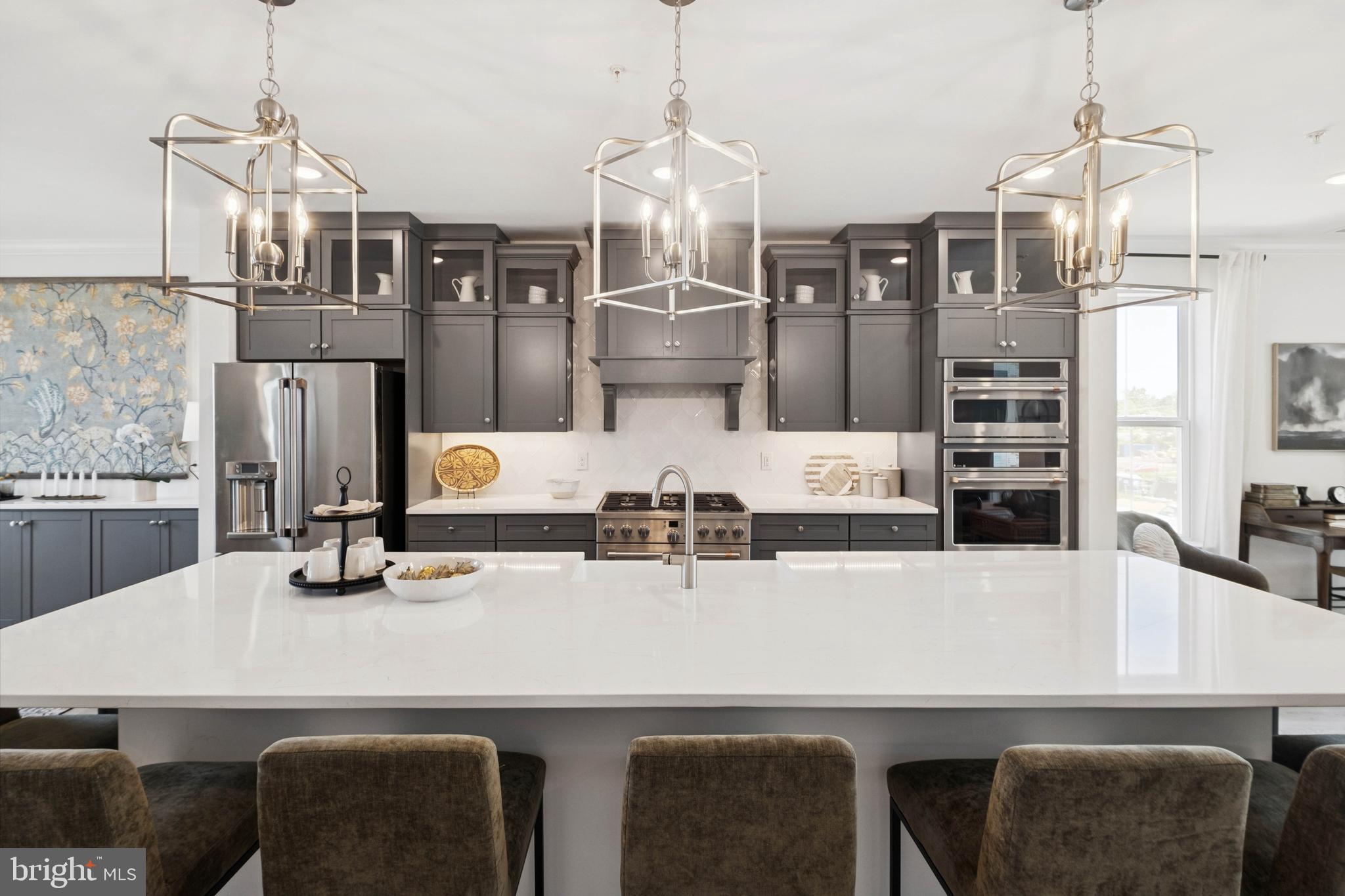 14962 Deco Circle Chantilly, VA 20151 - Photo 35 of 53 a kitchen with a table chairs and refrigerator