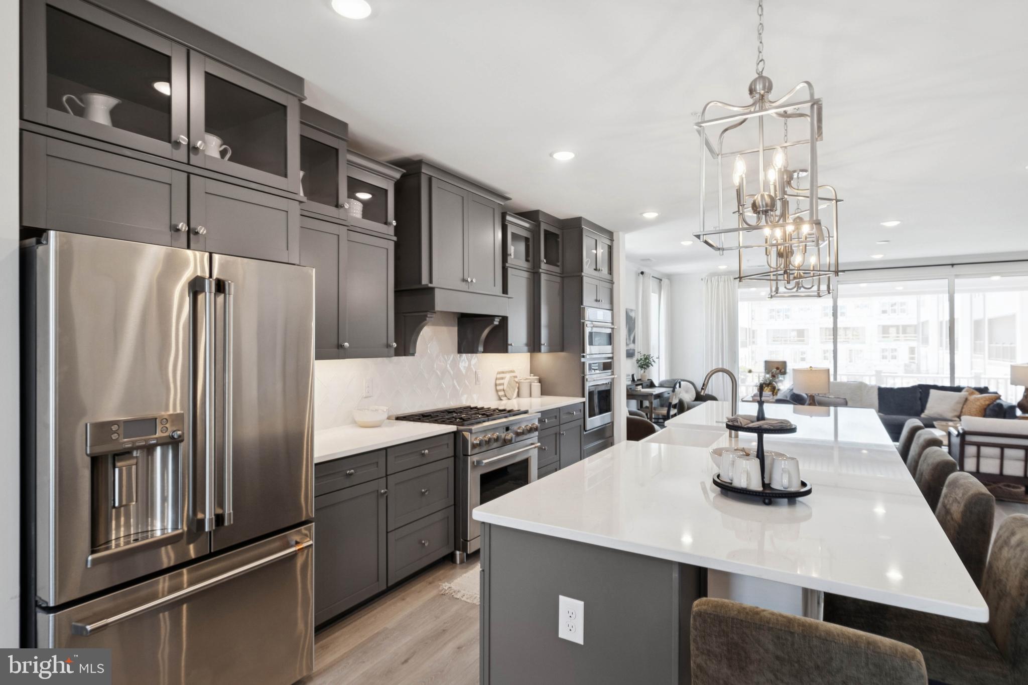 14962 Deco Circle Chantilly, VA 20151 - Photo 40 of 53 a kitchen with stainless steel appliances a sink a stove a refrigerator and cabinets