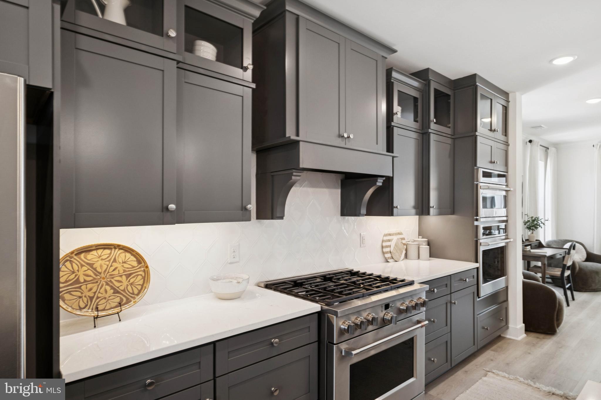 14962 Deco Circle Chantilly, VA 20151 - Photo 43 of 53 a kitchen with stainless steel appliances granite countertop a stove and a refrigerator