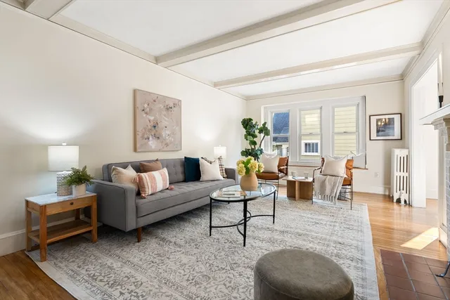 a living room with furniture and a lamp