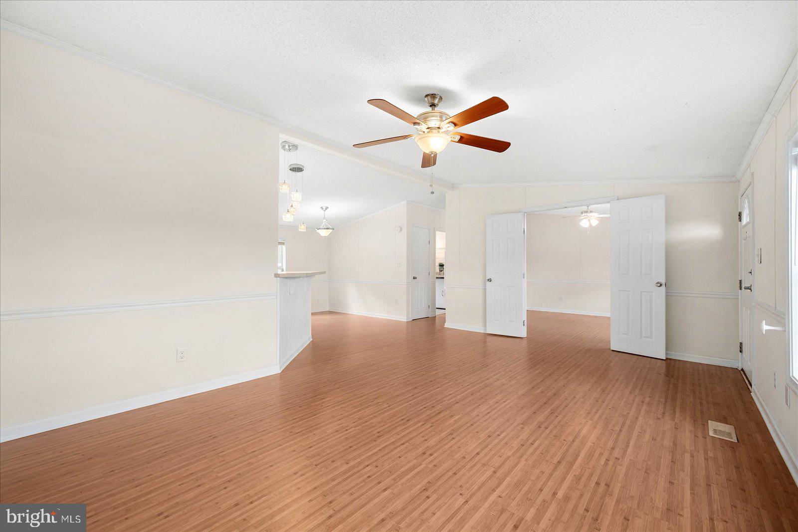 33512 Deer Run Road Frankford, DE 19945 - Photo 4 of 42 Living room view to kitchen/dining area
