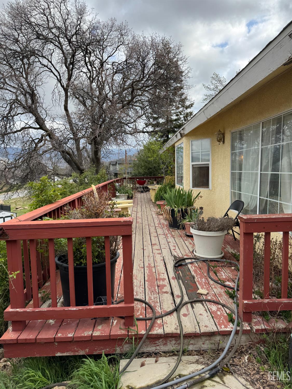 Undisclosed Address Tehachapi, CA 93561 - Photo 11 of 11 a view of a house with backyard furniture and garden