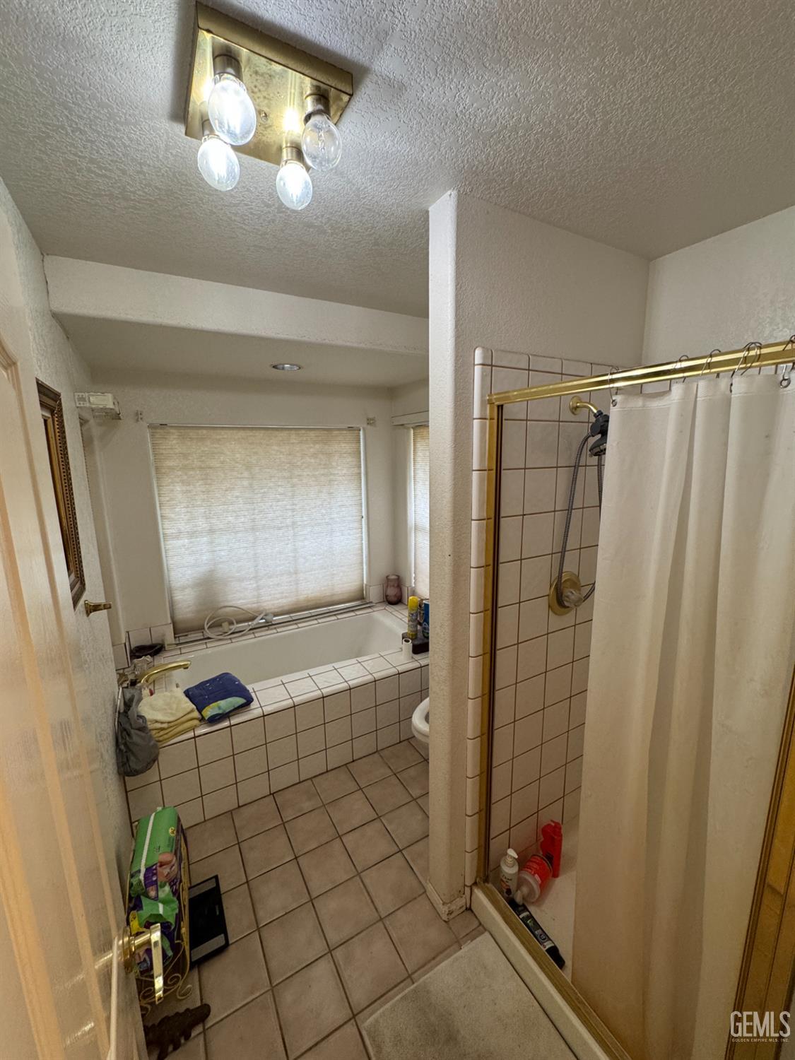Undisclosed Address Tehachapi, CA 93561 - Photo 8 of 11 a bathroom with a shower and a tub