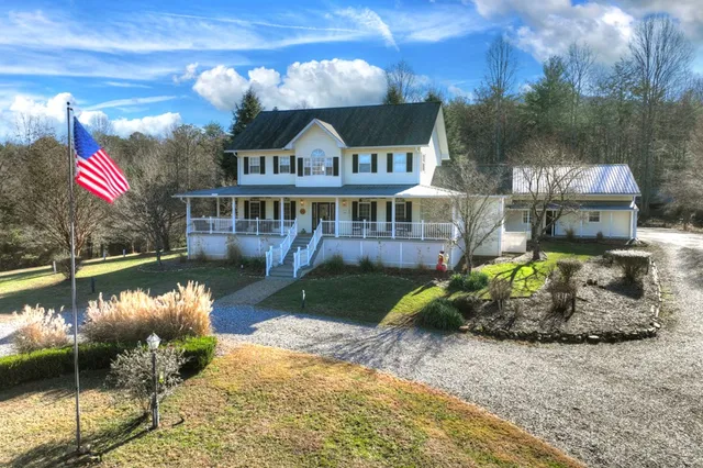 a view of a balcony dining table and chairs