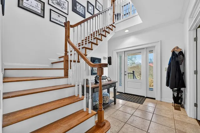 a bedroom with furniture and wooden floor