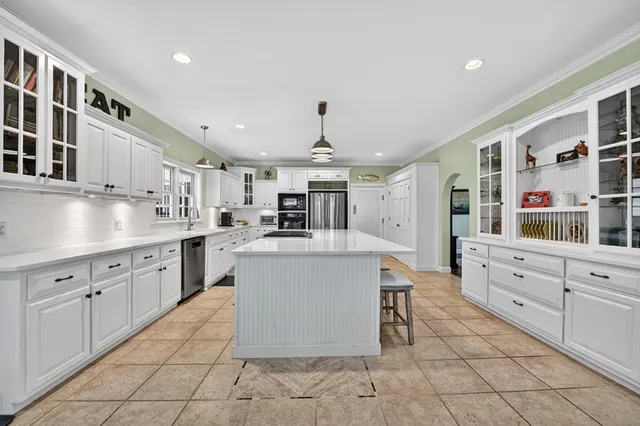 a bathroom with a glass shower door