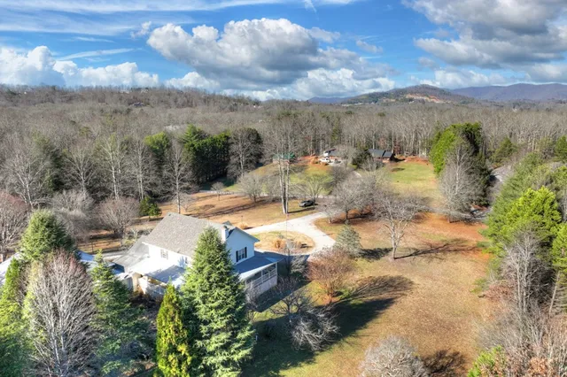 a view of a house with a mountain yard