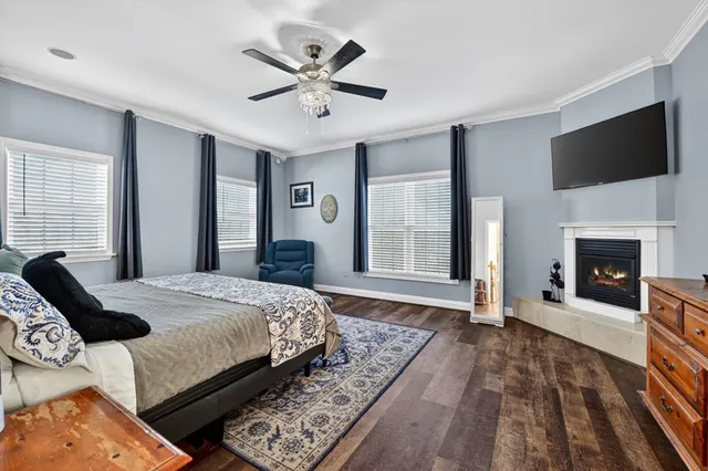 a front view of a house with a garden and a yard