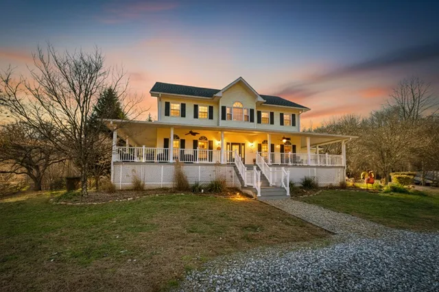 a aerial view of a house with roof deck