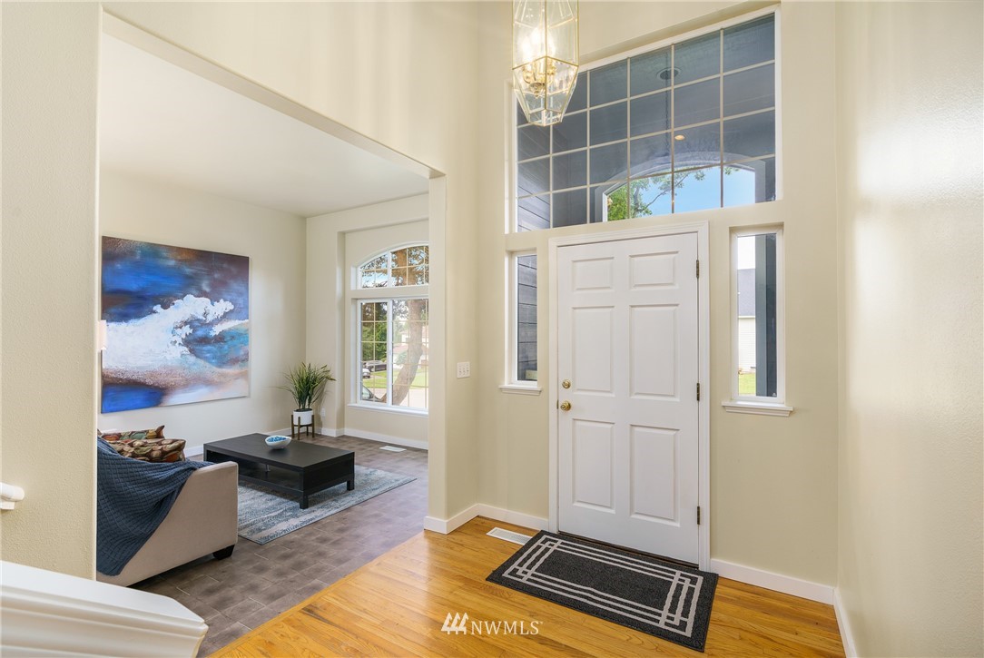 19104 113th Way Southeast Renton, WA 98055 - Photo 2 of 30 a living room with furniture and a window